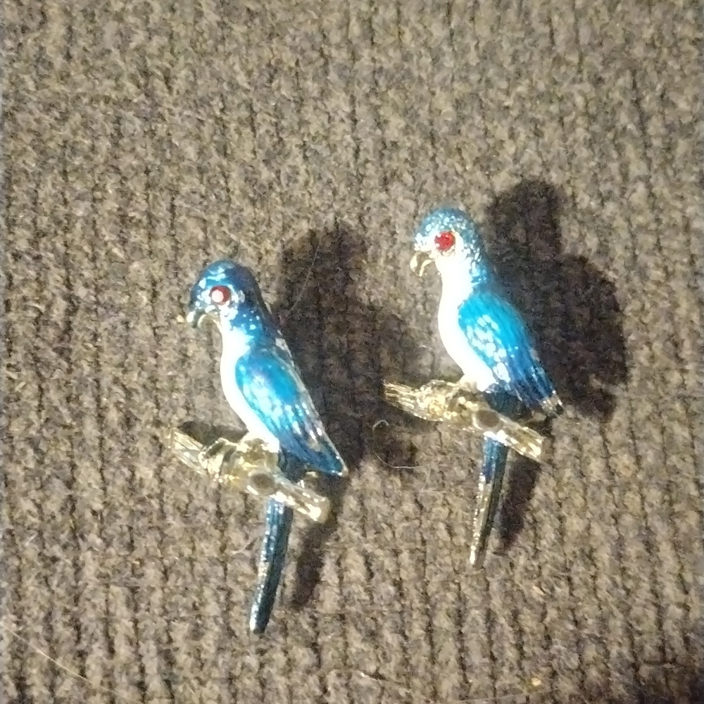 Two vintage blue parrots broches